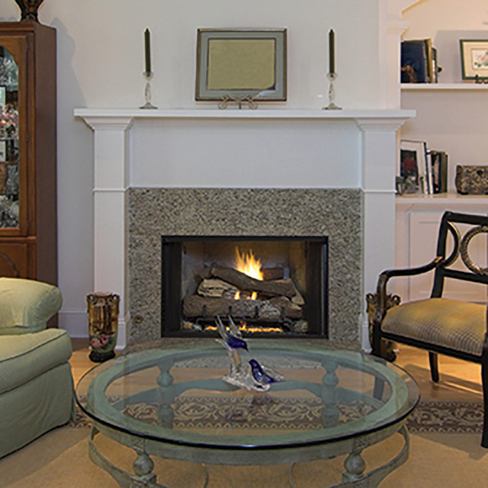 Fireplace insert with vent-free gas log set burning inside white mantel surround