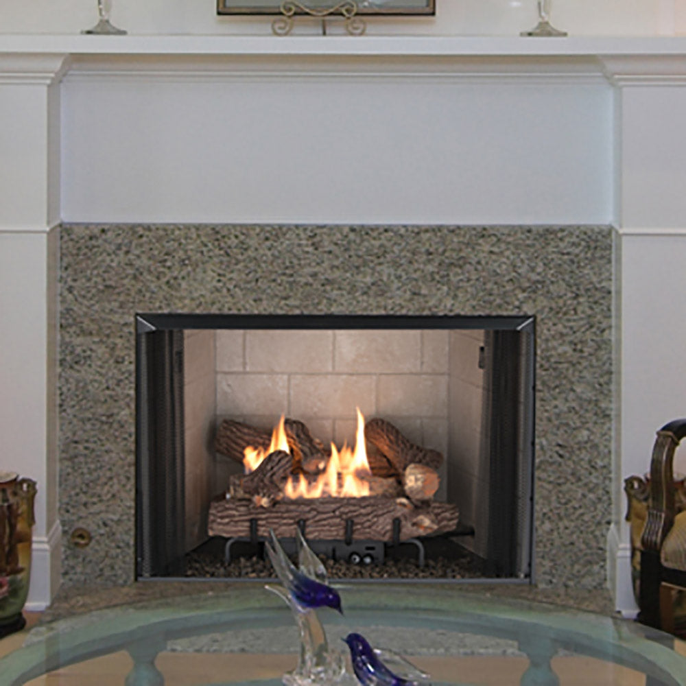 Vent-free gas log set in front of stone fireplace surround, burning logs