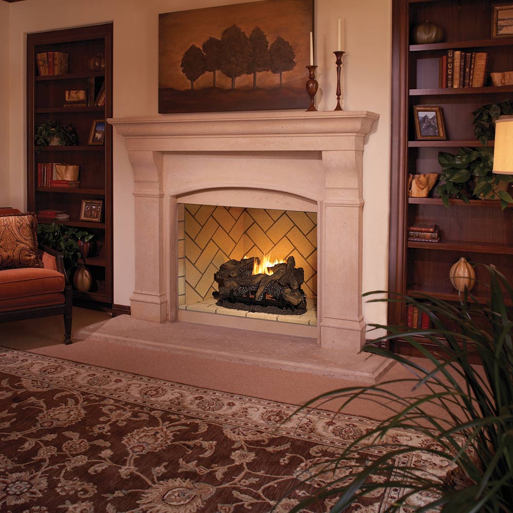 Vent-free gas log fireplace insert with mosaic tan firebox and white mantel surround