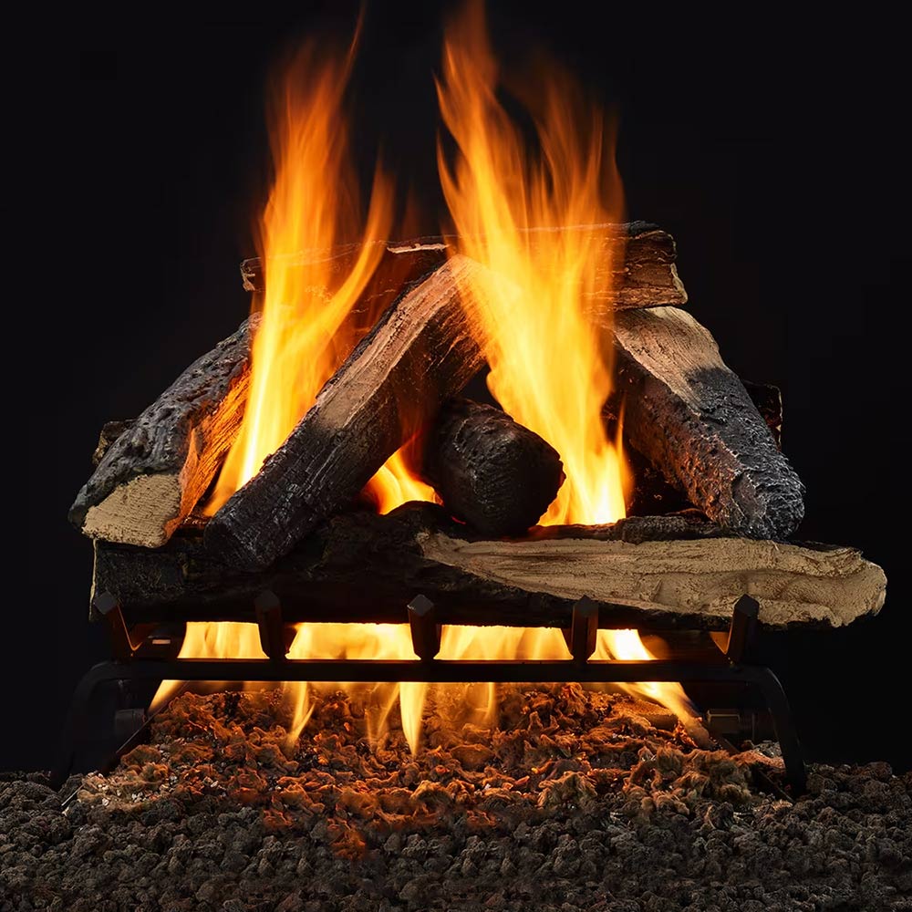 Indoor gas log set with stacked burning logs and bright flames