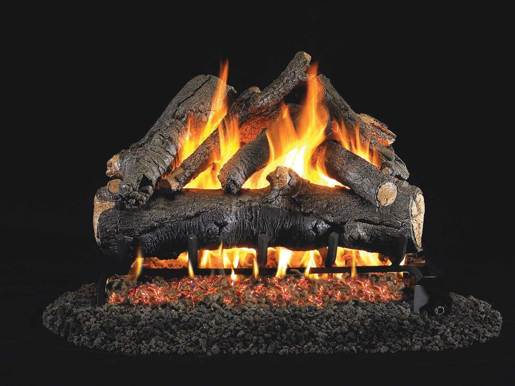 Vented gas log set with glowing orange flames and dark charred-style logs