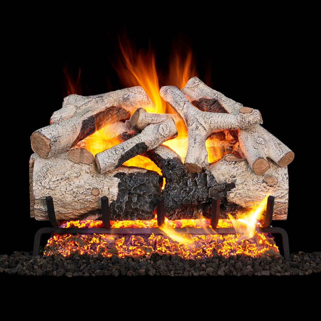 Vented gas log set with burnt aspen logs and glowing flames