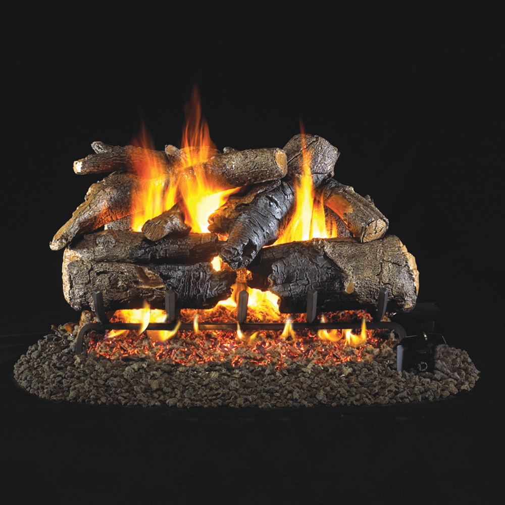 Charred American oak vented gas logs with glowing flames and burner base