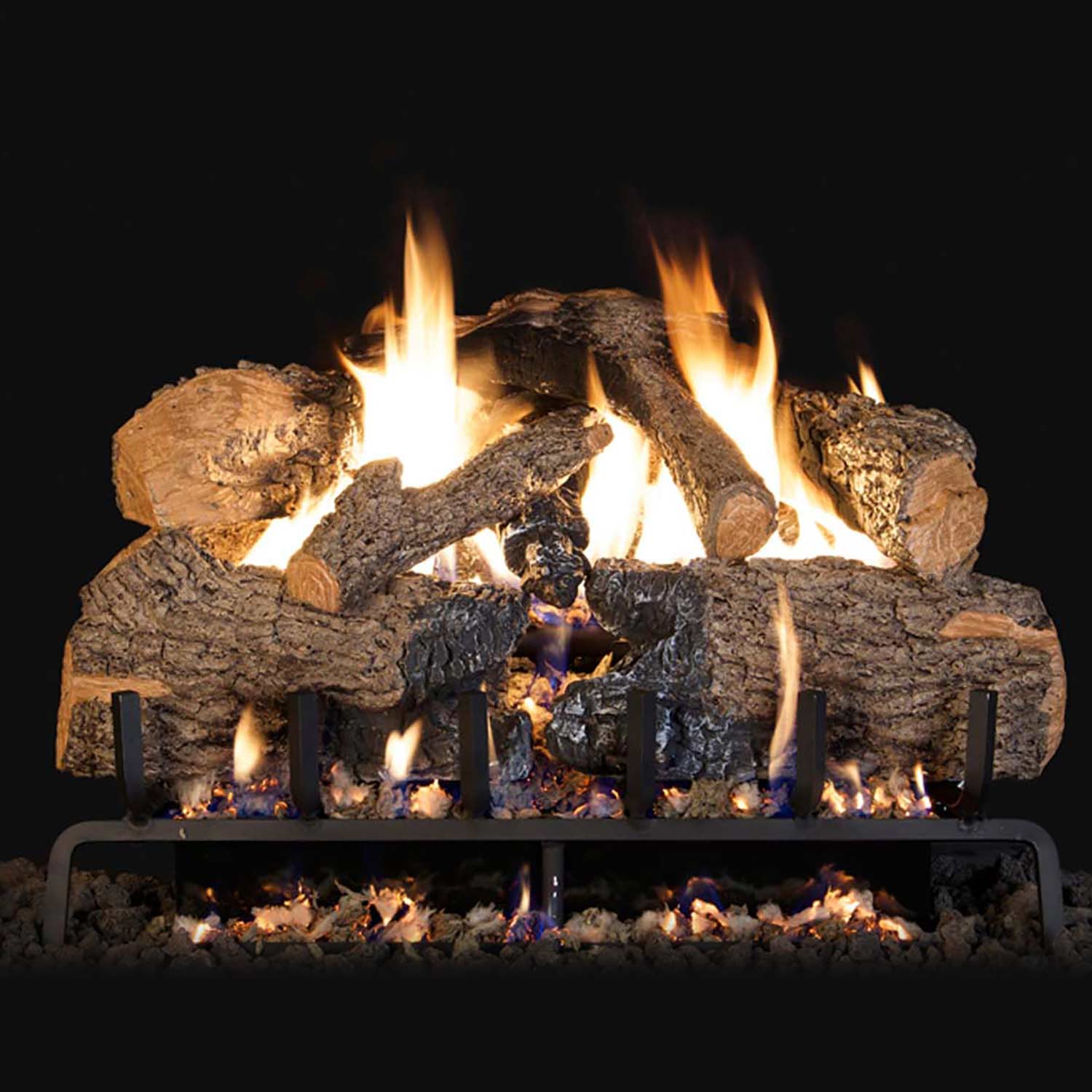 Charred angel oak vented gas log set with glowing flames and black burner grate