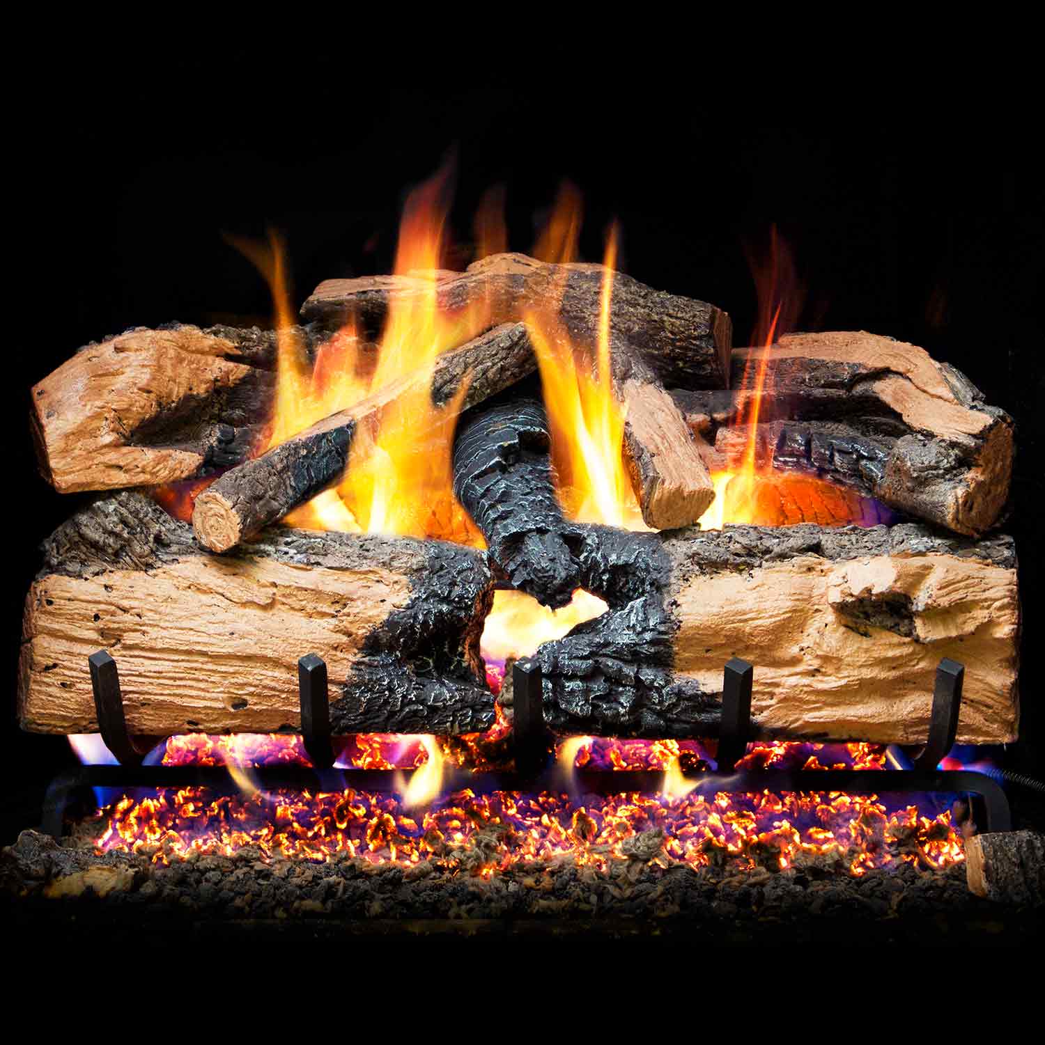 Charred split oak gas logs with glowing embers and orange flames