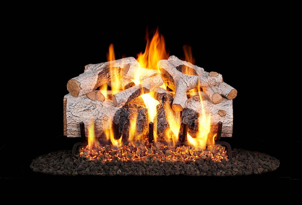 Charred mountain birch vented gas log set with glowing flames and faux log bed