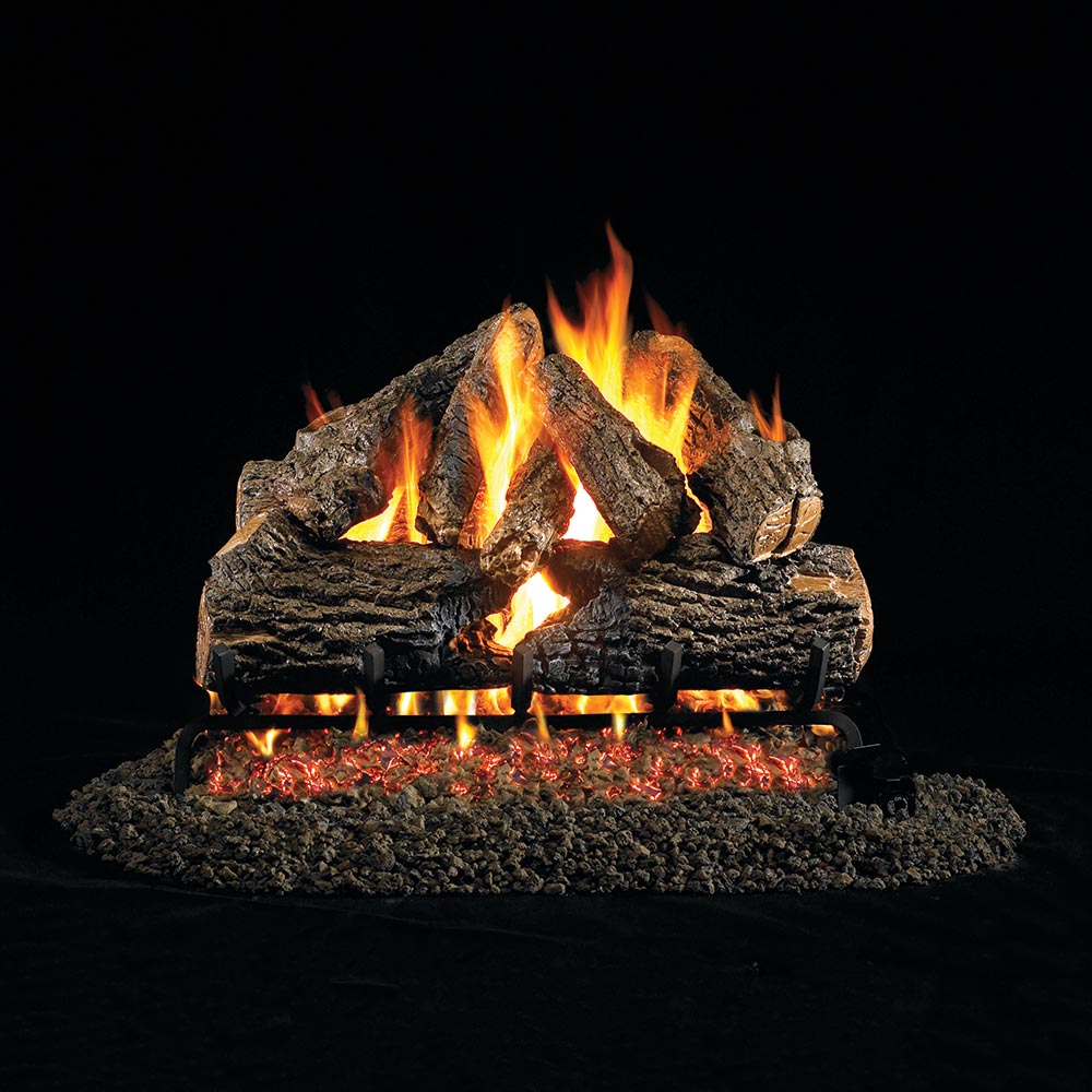 Vented gas log set with charred oak logs and active flames over burner base