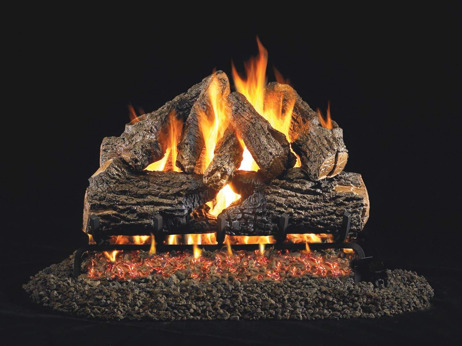 Charred oak vented gas log set with burning flames and glowing logs