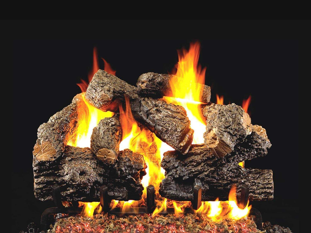 Vented gas log set with charred oak logs and bright flames