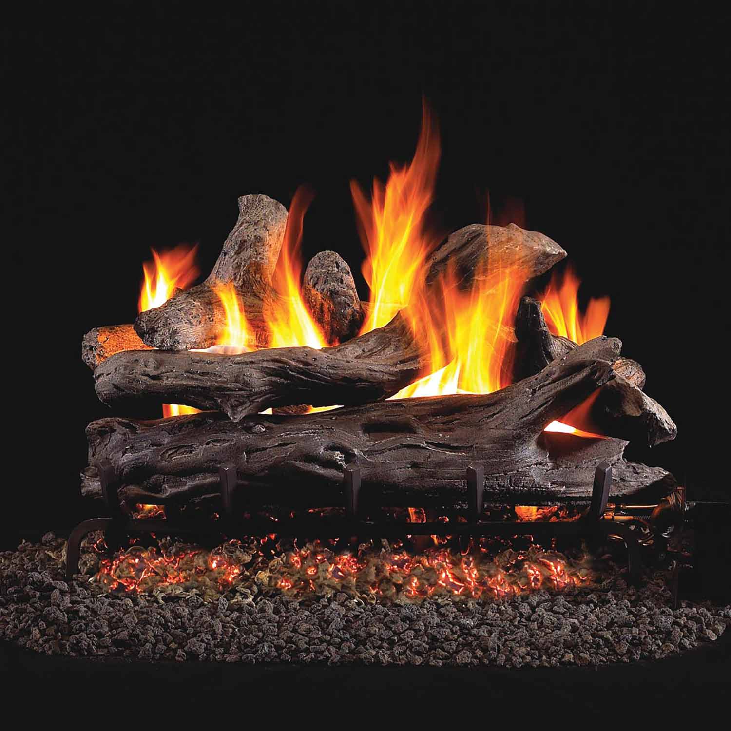 Vented gas log set with driftwood-style logs and burning flames