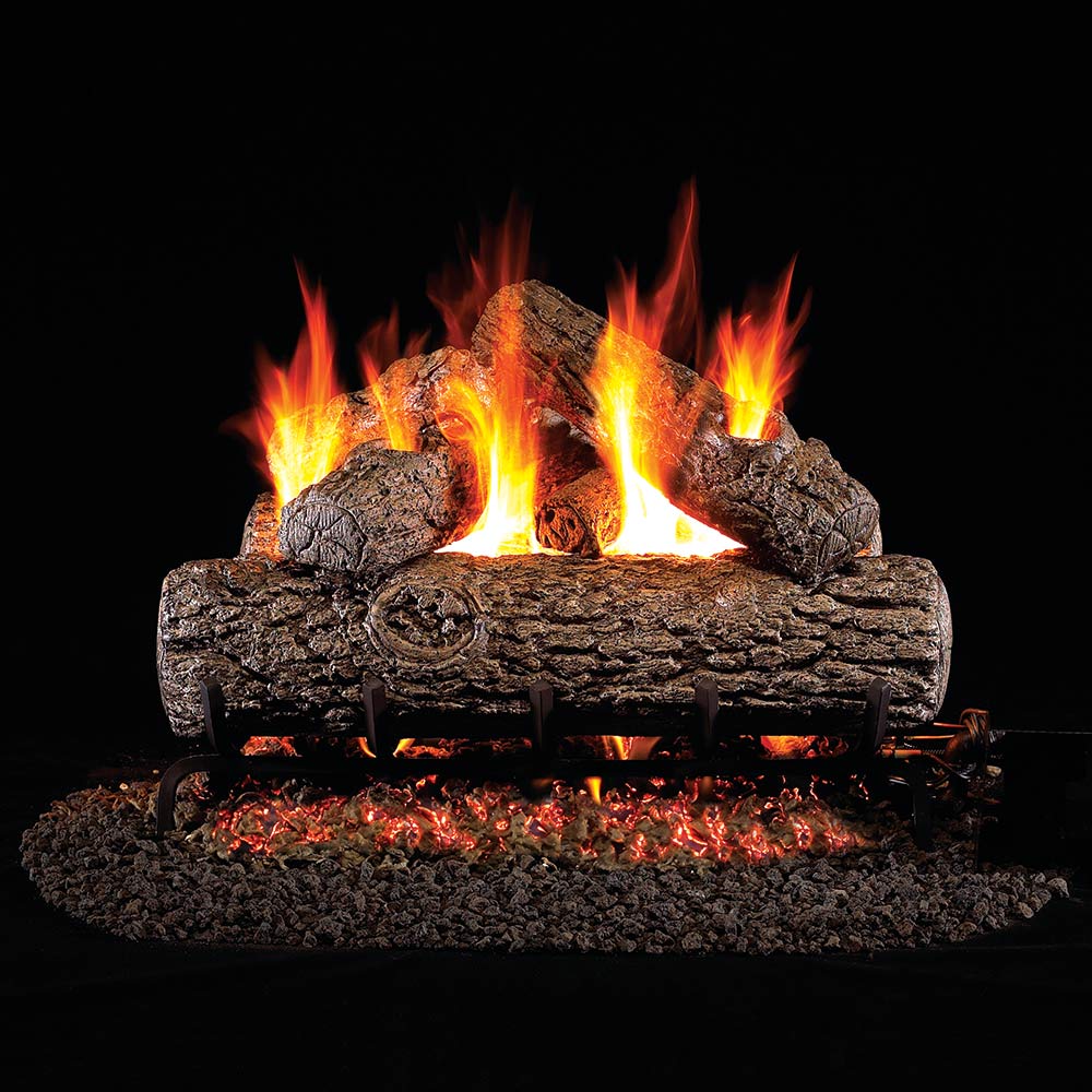 Real Fyre vented gas fire logs with burning flames and charred log texture