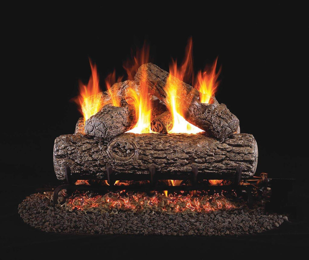 Vented gas log set with glowing flames and stacked charred logs in a stone base