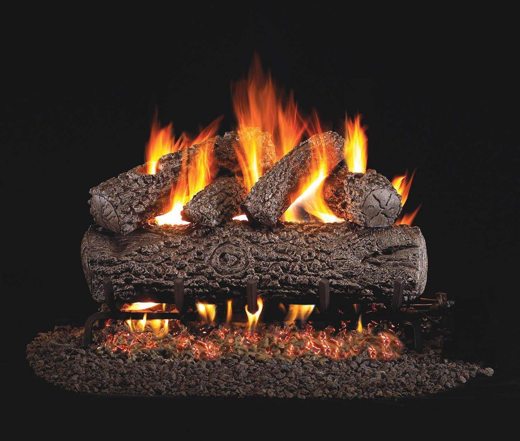 Vented gas log set with burning flames over dark split logs