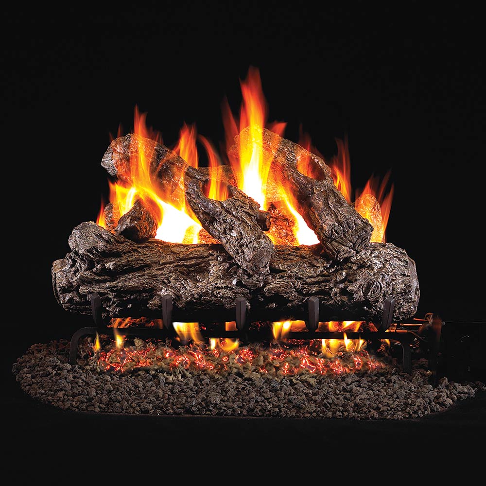 Burning vented gas log set with rustic dark logs and glowing orange flames