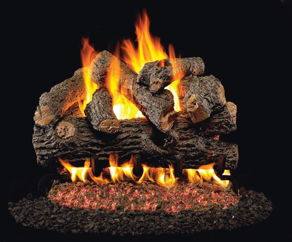 Vented gas log set with burning flames over a dark crushed ember bed