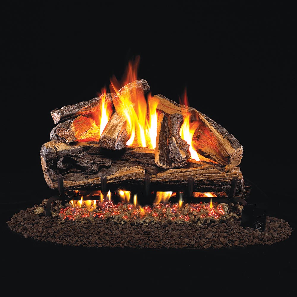 Vented gas log set with burning split oak logs and glowing embers