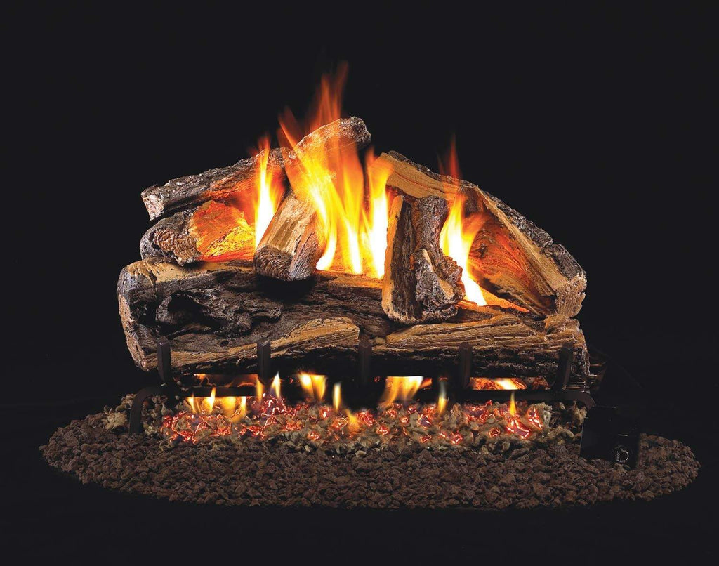 Vented gas log set with burning flames over split oak-style logs