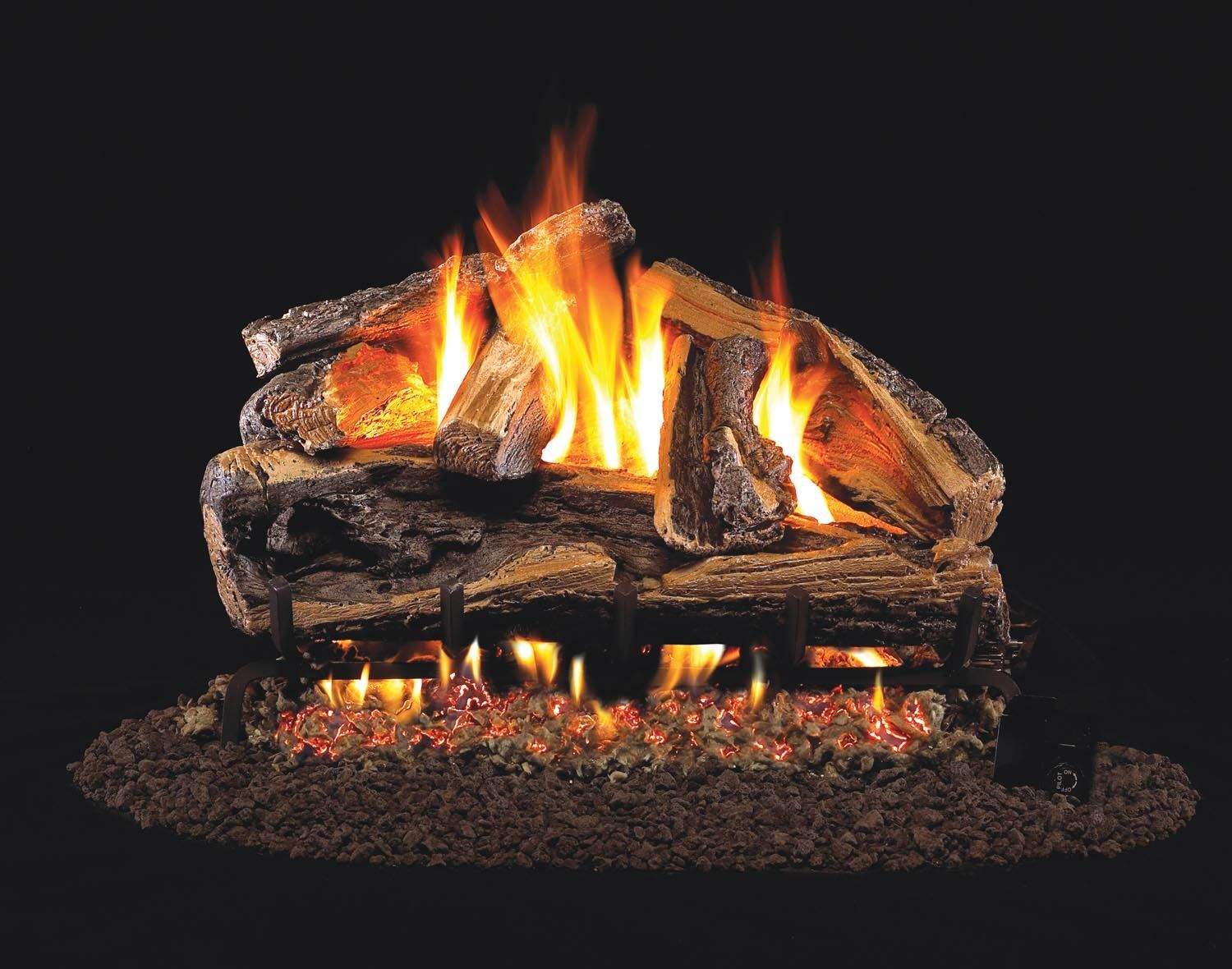 Vented gas log set with burning flames over split oak-style logs