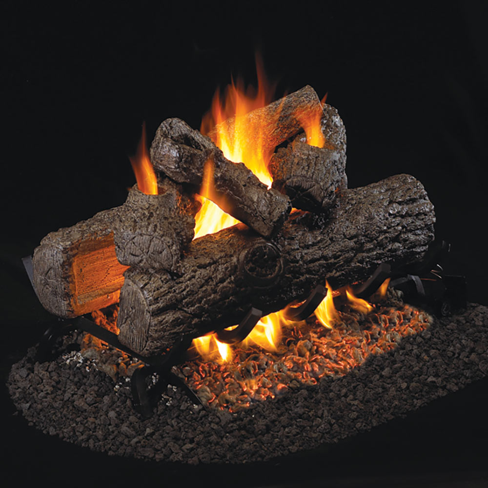 Vented gas log set with dark logs and orange flames