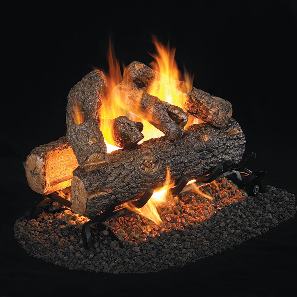 Decorative gas log set with burning flames and charred wood pieces, glowing embers