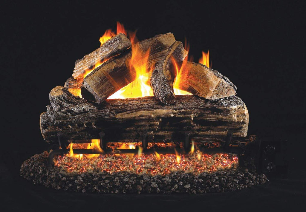 Vented gas log set with split oak logs and orange flames in a fire bed