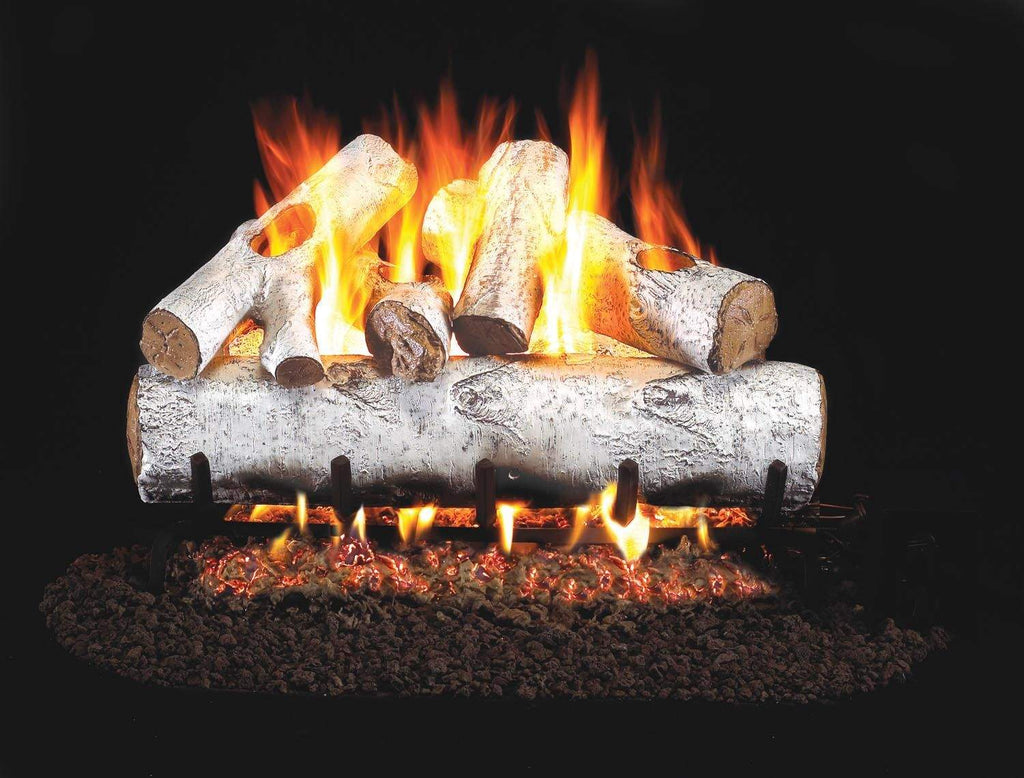 Vented gas log set with white birch logs and active flames in a gray firebox