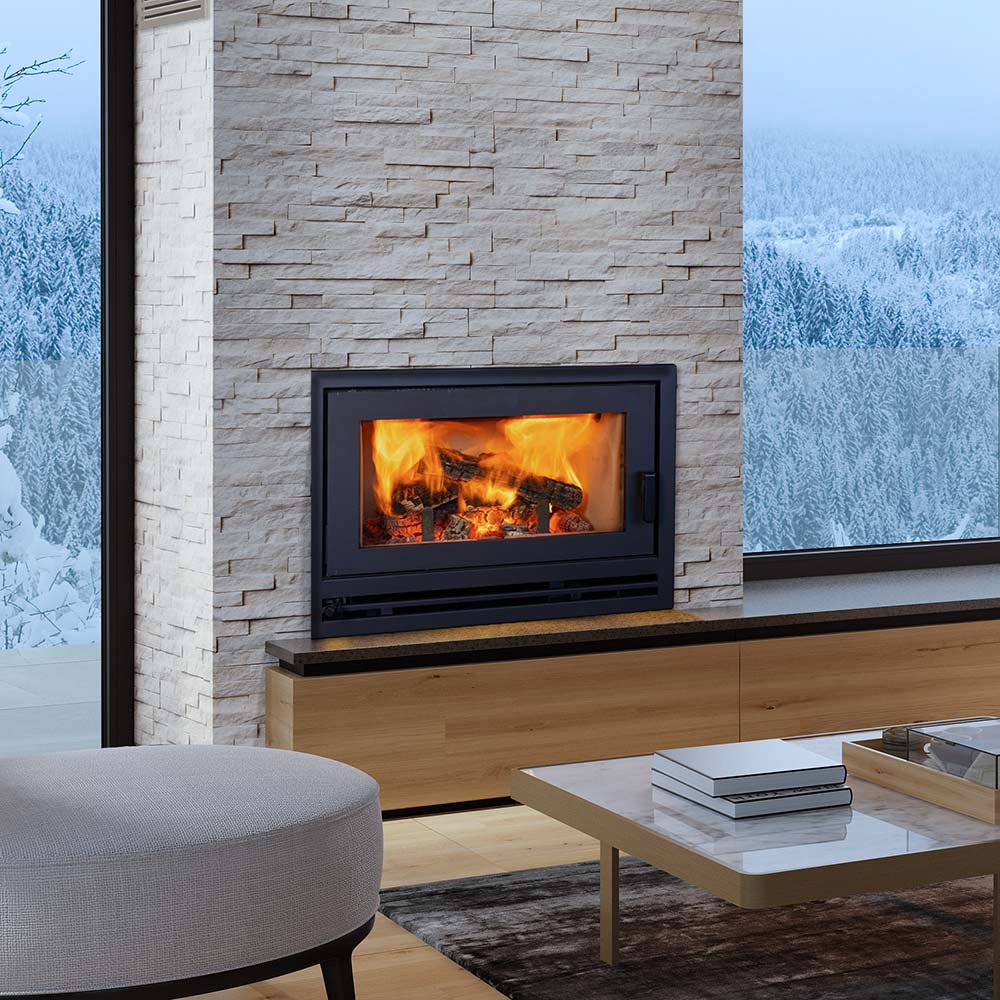 Black wood-burning fireplace insert with glass door in stone surround