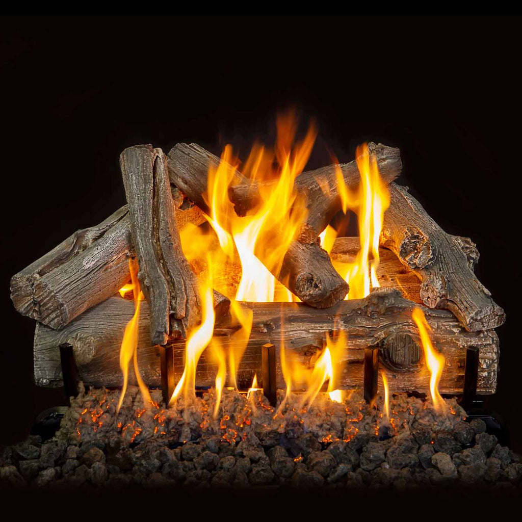 Vented gas log set with driftwood-style logs and visible flames over decorative embers