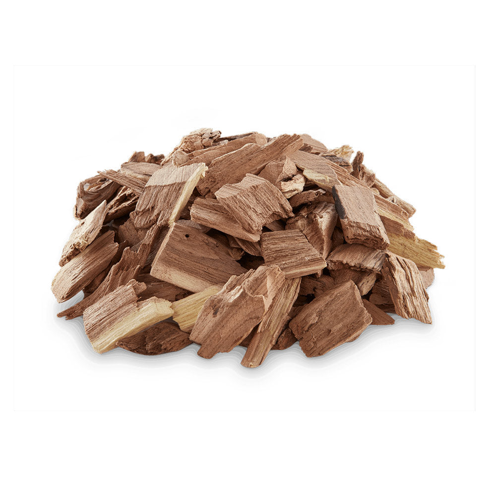 Mesquite wood chips pile of light brown wood flakes