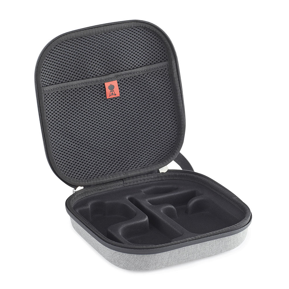 Storage case open with black mesh top and molded compartments for accessories