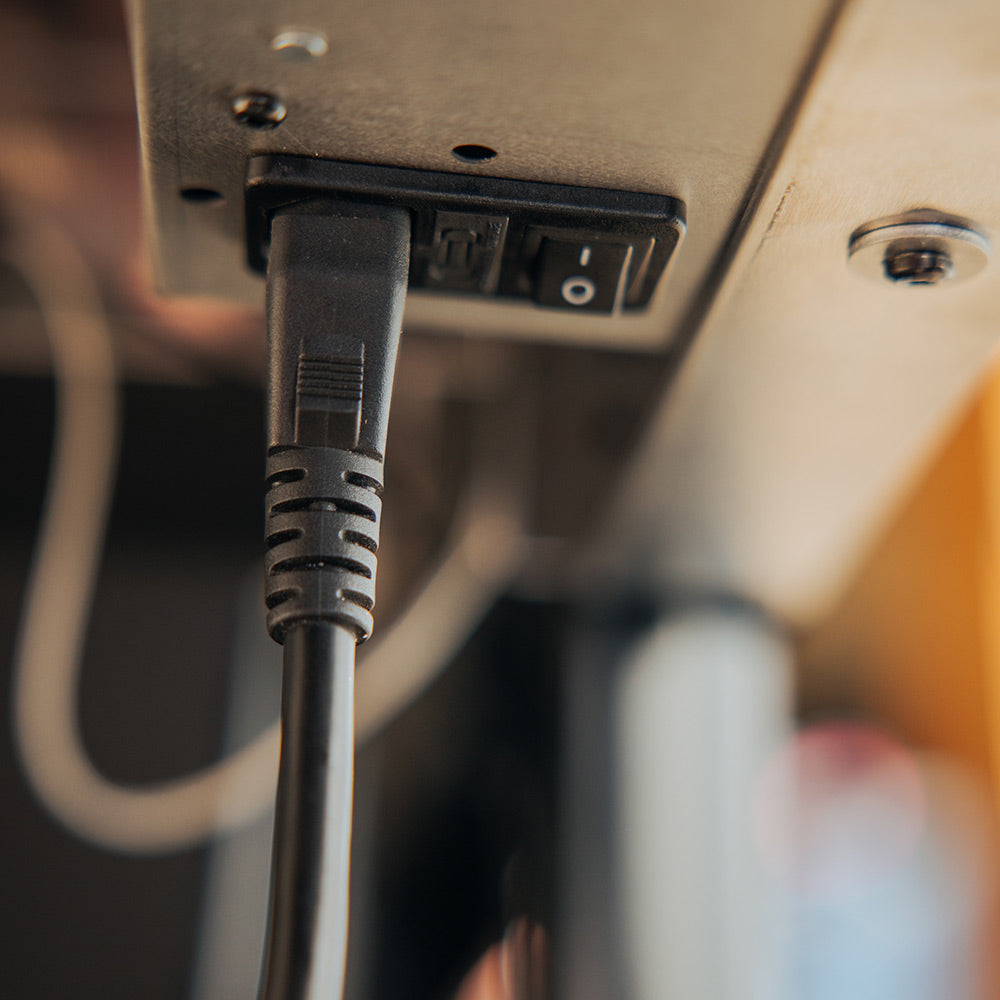 Grill power cord plugged into the control panel outlet