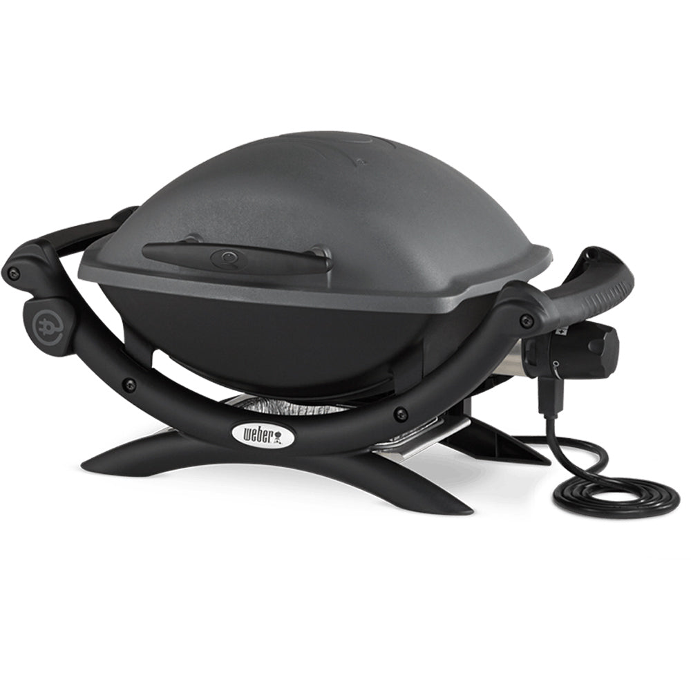 Electric grill with closed lid, black base and handles, connected power cord