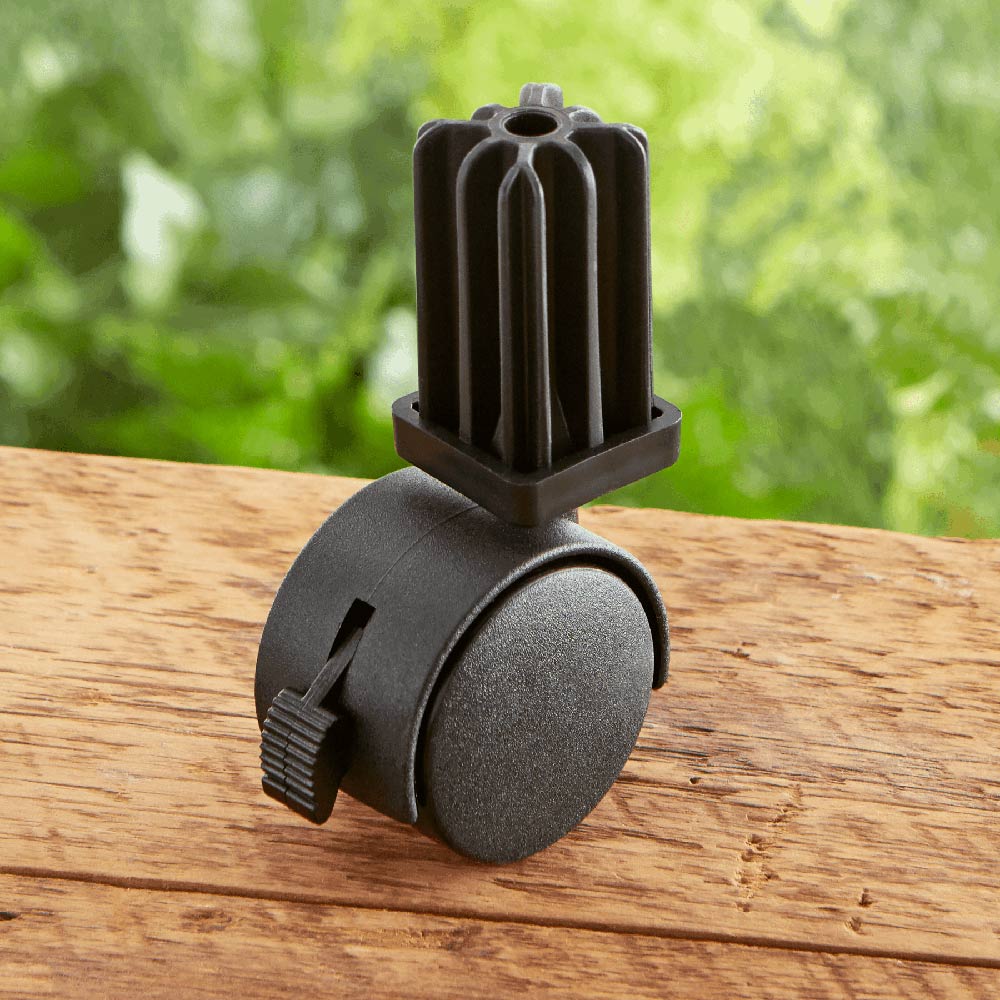 Weber locking replacement caster wheel on wood surface, black rubber and stem
