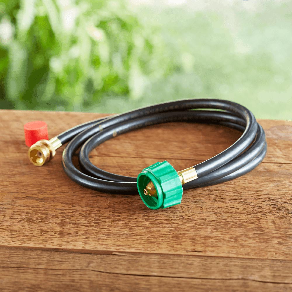 Black adapter hose with brass ends and green quick-connect fitting