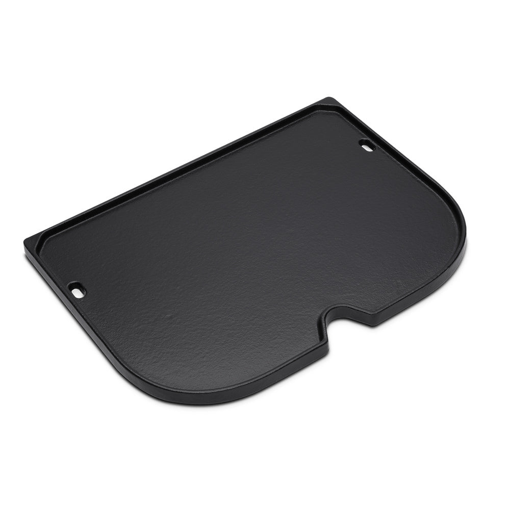 Black griddle plate with side cutout and two mounting holes, flat cooking surface