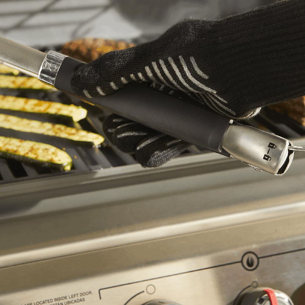 Stainless steel grill tongs with black grip and hanging loop