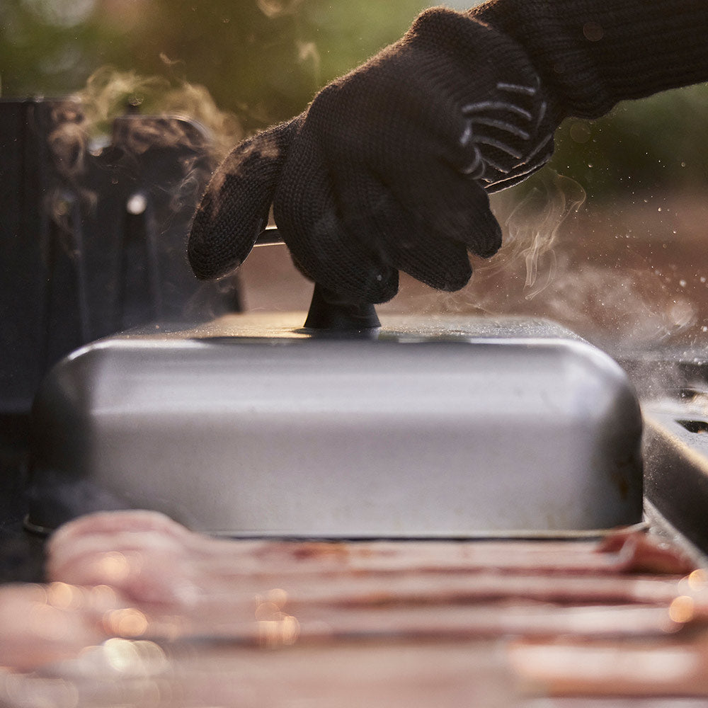 Weber griddle basting dome on grill, covering food while cooking