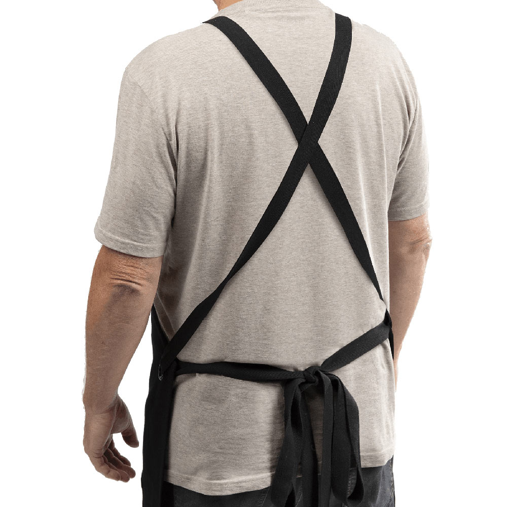 Black crossback apron with crisscross back straps and waist tie