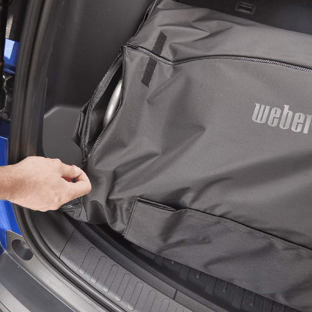 Grill cover with pocket detail and zipper seam, dark gray fabric with Weber logo