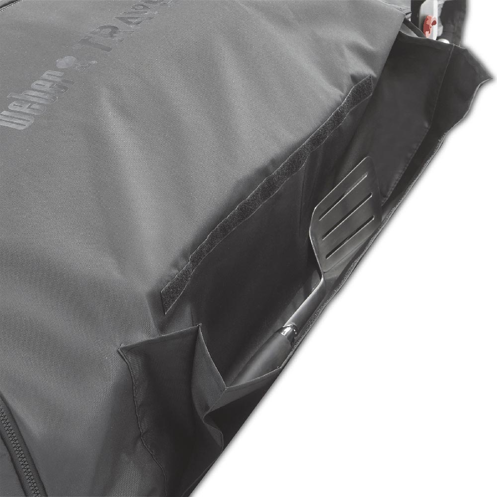 Corner view of cargo protector cover with stitched edge and side pocket, dark gray