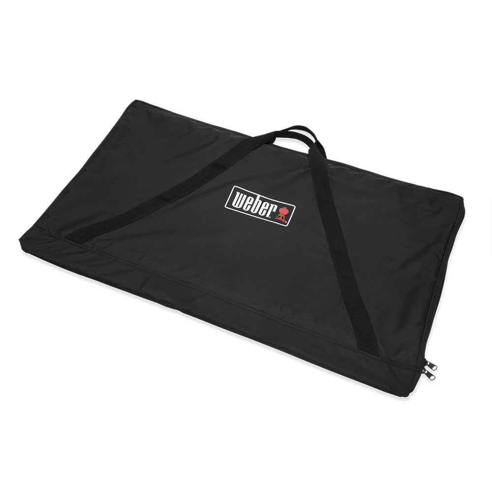 Weber griddle storage bag, black with carrying handles and front Weber logo