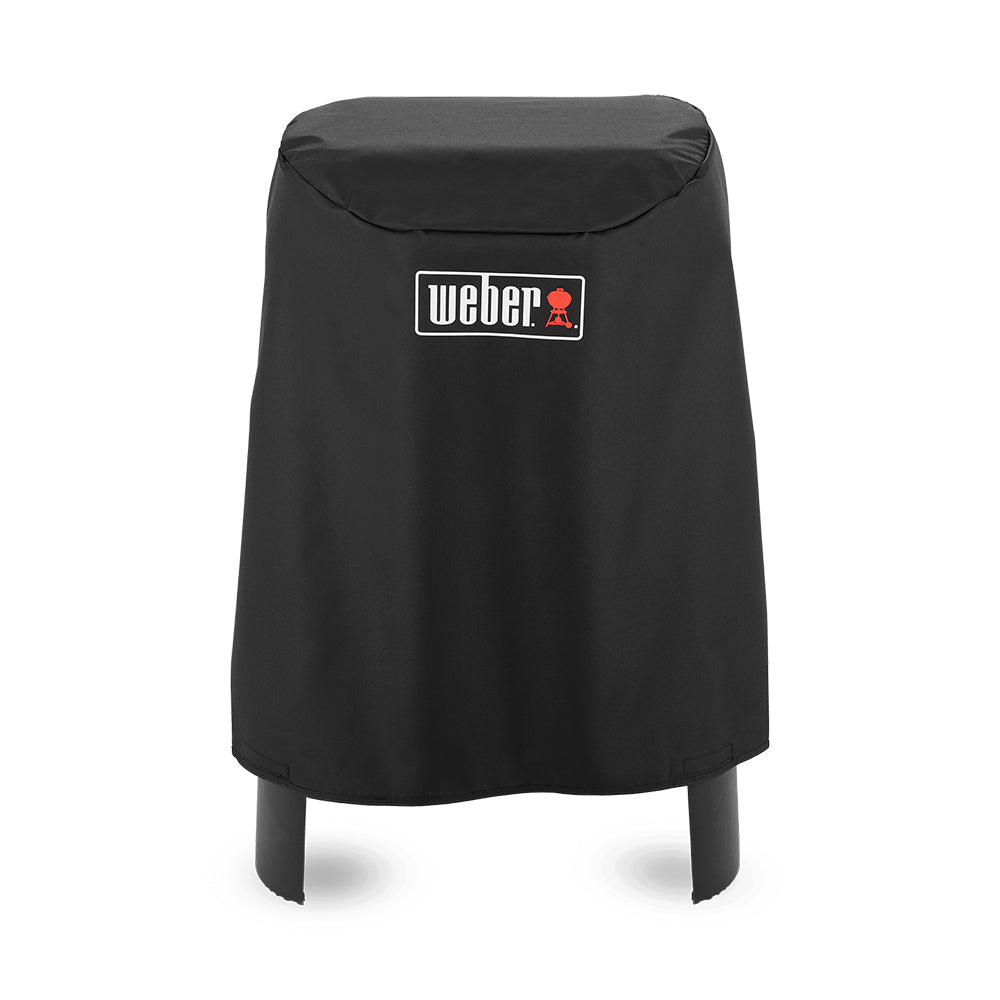 Black Weber grill cover with badge, rounded top and open stand leg cutouts
