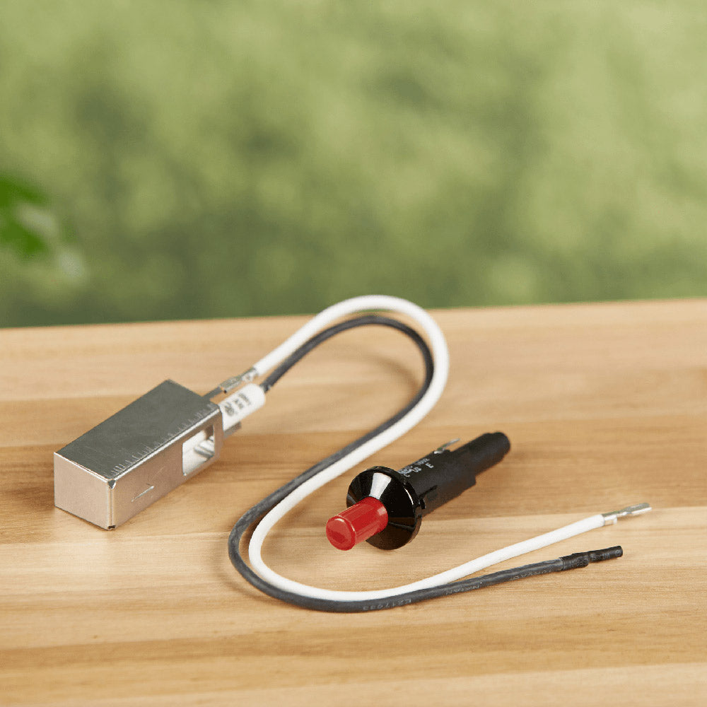 Weber igniter kit with grounded electrode plug, wire leads, and red button igniter