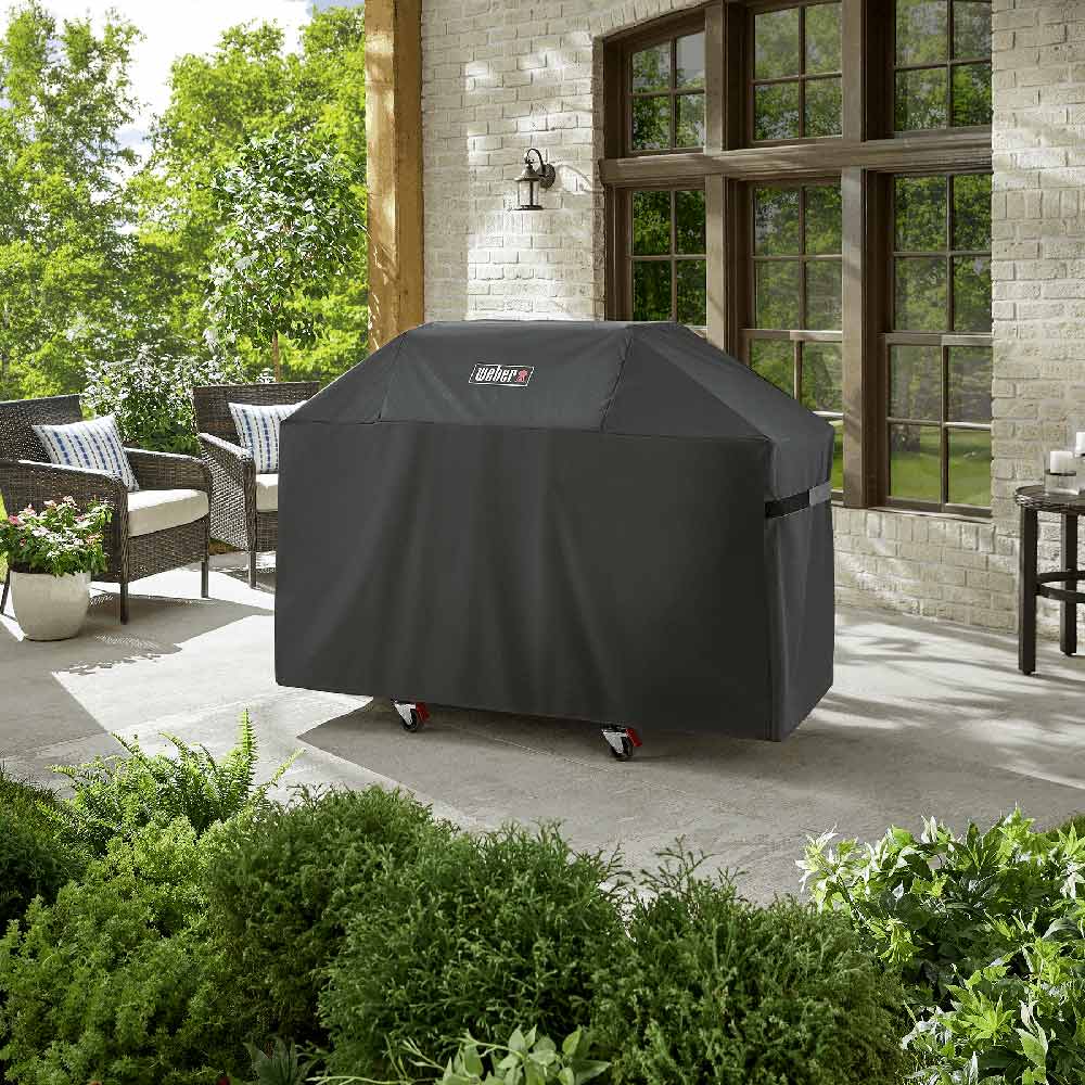 Charcoal Weber grill cover with logo, full-coverage fitted cover on rolling base