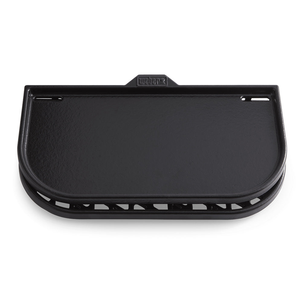 Black cast-iron griddle insert side view with central logo and top handle holes