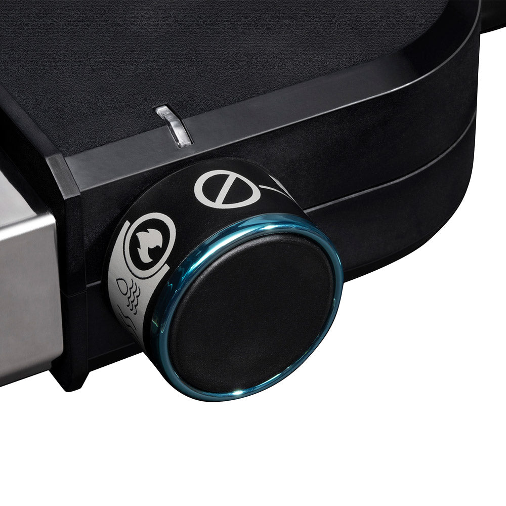 Control knob with blue ring light on black portable electric grill