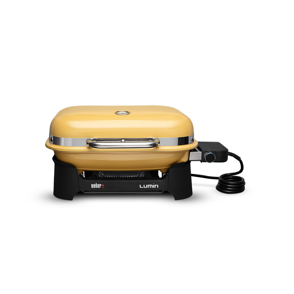 Weber Lumin portable electric grill, golden yellow lid with front handle and control knob