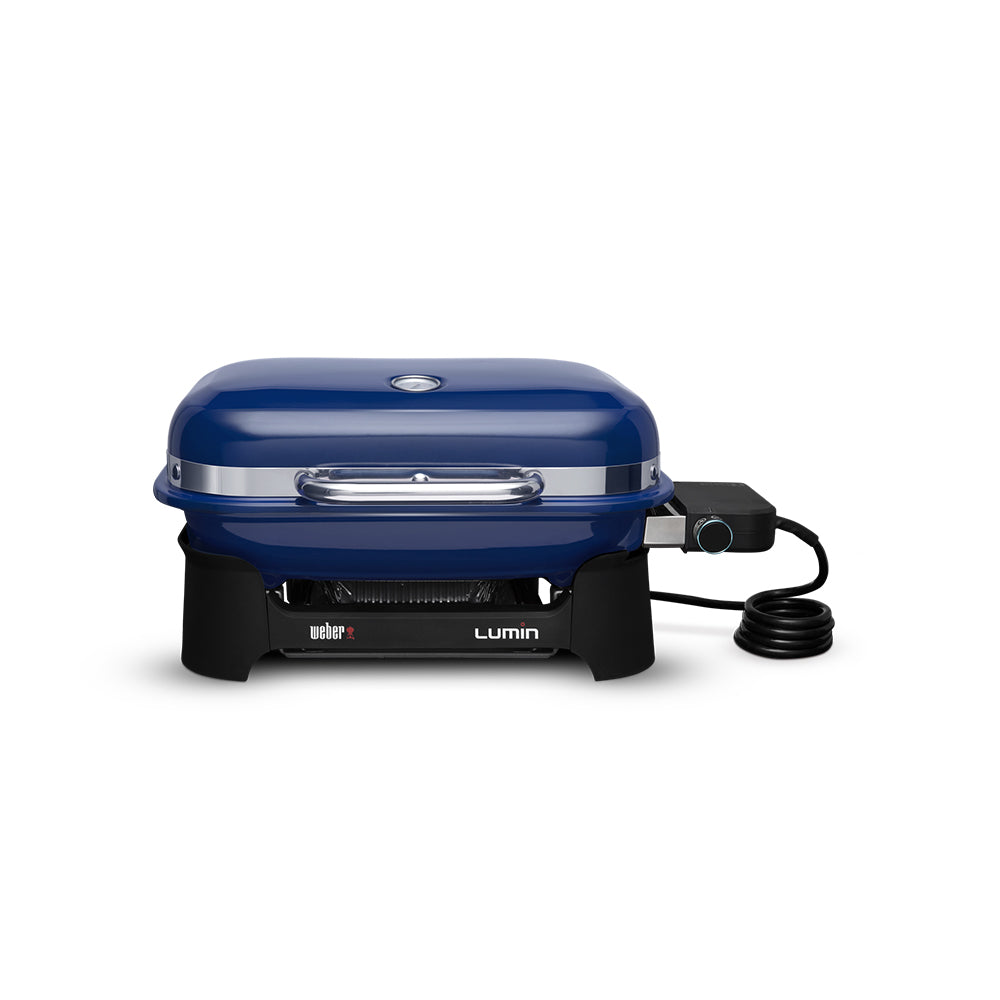Portable electric grill with deep blue lid, control knob, and power cord