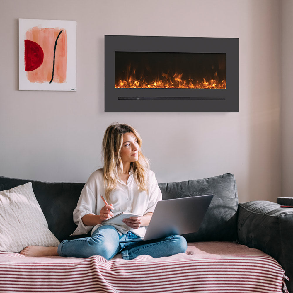 Wall-mounted electric fireplace with steel surround and glowing flame screen