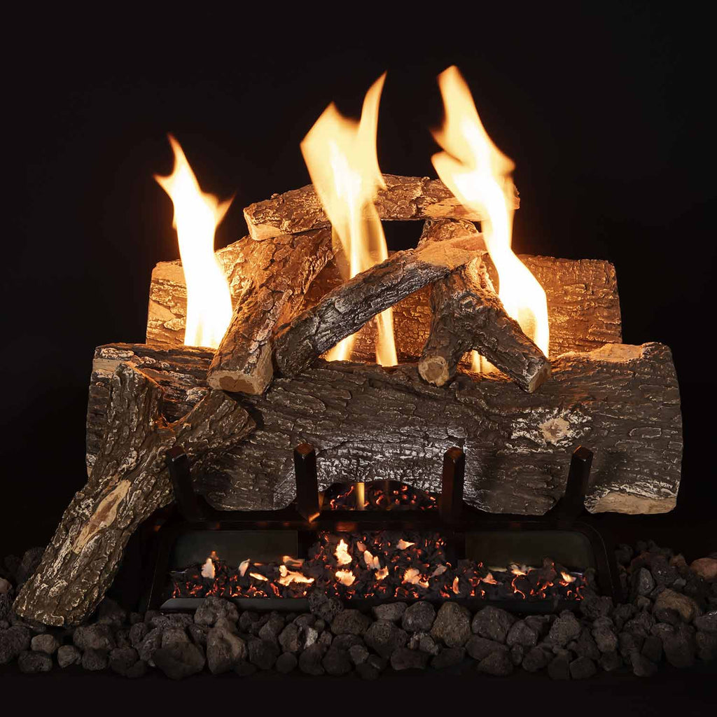 Vent free gas log set with weathered oak logs and flames in front of burner